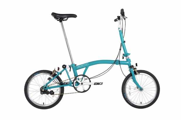Folding bike reviews A photography of a light blue Brompton folding bicycle on a white background