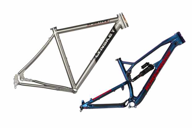Frame reviews Photograph of a silver road bike frame and blue and red mountain bike frame on a white background