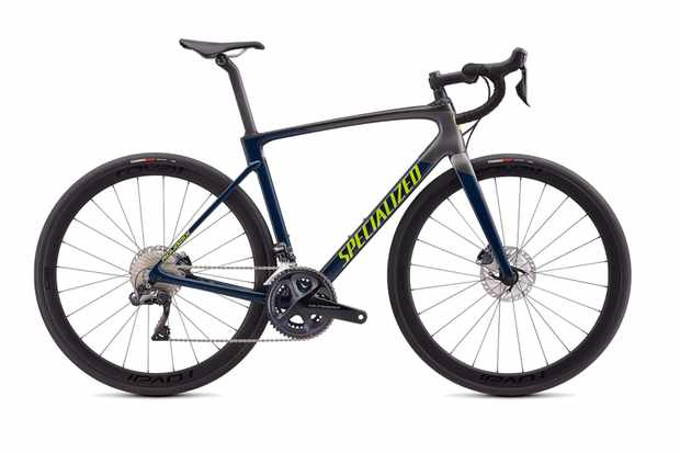 Black road bike on a white background with 'Specialized' written in yellow on the frame